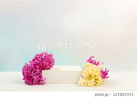 Abstract beautiful flower arrangement with hyacinths,banner.Empty product podium and fresh live spring flowers.Stage for business concept.Minimal modern aesthetics and elegant beauty concept Abstract beautiful flower arrangement with hyacinths,banner.Empty product podium and fresh live spring flowers.Stage for business concept.Minimal modern aesthetics and elegant beauty concept 125803333