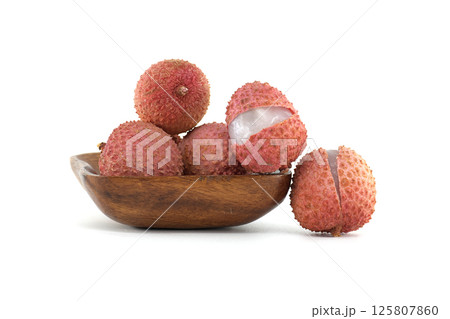 Fresh Ripe Lychee Fruits in a Wooden Bowl on White Background 125807860
