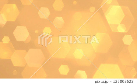 Warm light background with soft golden tones featuring hexagon bokeh highlights creates radiant atmosphere, perfect for abstract designs 125808622