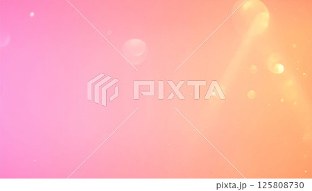 Ethereal warm pink and orange gradient background with glowing soft light and shimmering sparkles creates dreamy atmosphere. Perfect for various creative projects 125808730