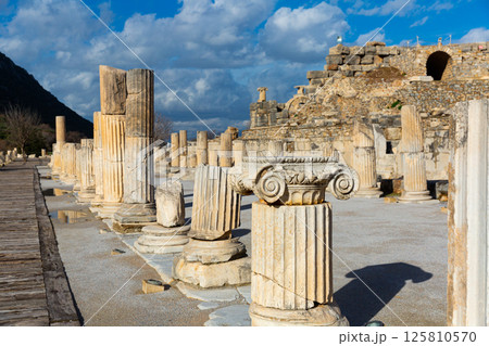 State Agora columns in ancient Ephesus with Odeon ruins in background State Agora columns in ancient Ephesus with Odeon ruins in background 125810570