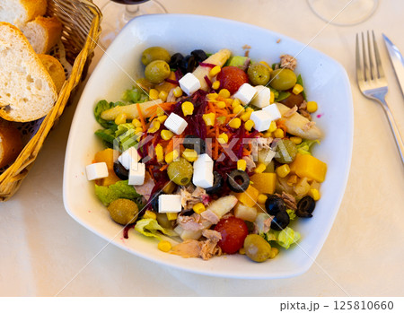 Portion of fresh mediterranean salad Portion of fresh mediterranean salad 125810660