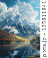 The sun shines on the snow-capped mountains and the lake in the valley 125811841