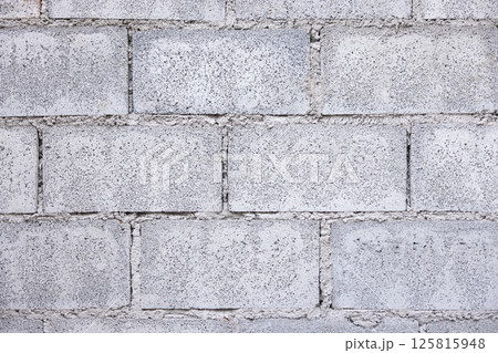 Concrete block wall background in horizontal composition. Concrete block wall background in horizontal composition. 125815948