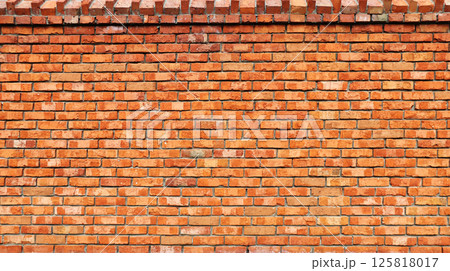 Full horizontal texture of an aged brick wall. The background texture is that of a retro brick wall 125818017