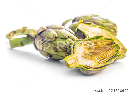 Ripe artichokes plant isolated on white background. Ripe artichokes plant isolated on white background. 125818693