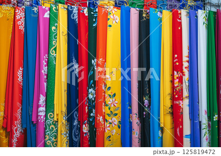 colorful silk scarves at Asian textile market in Vietnam close-up colorful silk scarves at Asian textile market in Vietnam close-up 125819472