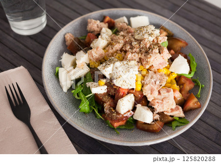 Closeup of salad with fish and vegetables for lunch 125820288