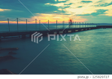 Pier on the lake Balaton at sunset. Siofok, Hungary Pier on the lake Balaton at sunset. Siofok, Hungary 125820727