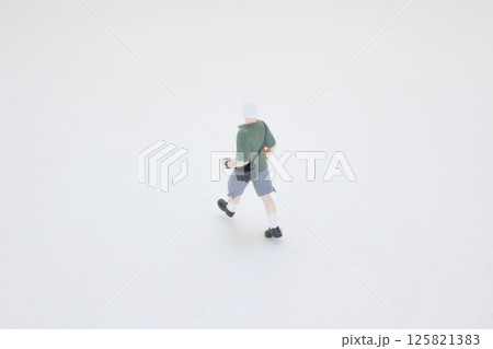 Figure of a Traveler in Casual Attire on White Background Figure of a Traveler in Casual Attire on White Background 125821383