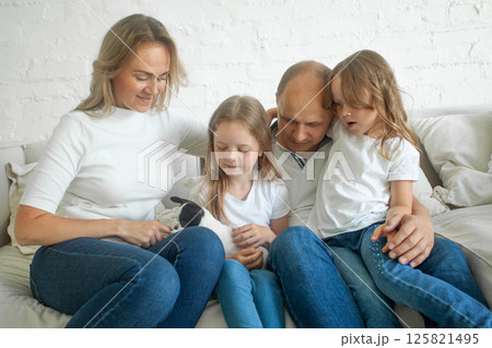 Cheerful family mother, father and children with little dog Cheerful family mother, father and children with little dog 125821495