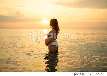 Woman Expecting Her Future Baby At The Sea  125822345