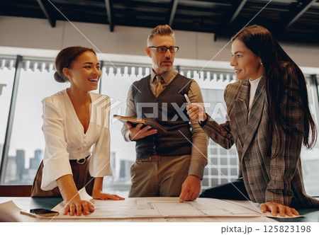Engaging Business Meeting with Skilled Professionals in a Modern and Stylish Office Space Engaging Business Meeting with Skilled Professionals in a Modern and Stylish Office Space 125823198