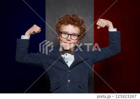 Clever child boy on French flag background. Education, travel, school, camp and study language 125823267