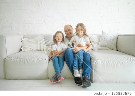 Smiling family. Man and children at home Smiling family. Man and children at home 125823679
