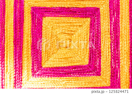 Closed up of pink and yellow color square shape of weave textured background with copy space Closed up of pink and yellow color square shape of weave textured background with copy space 125824471