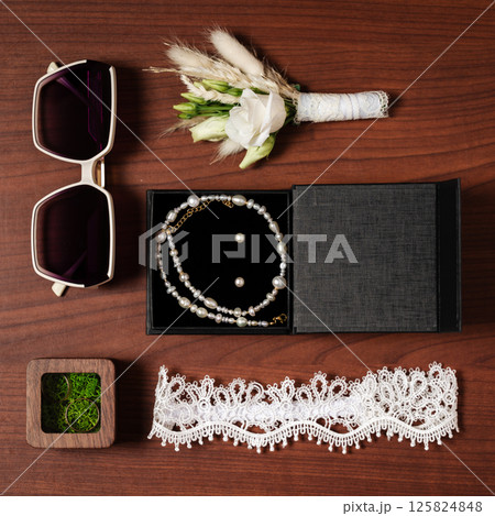 Bridal accessories: jewelry, flowers, sunglasses, garter. Bridal accessories: jewelry, flowers, sunglasses, garter. 125824848