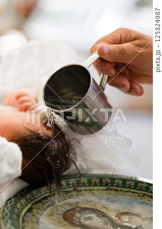 Infant baptism ceremony: a sacred moment of blessing and new beginnings. 125824987