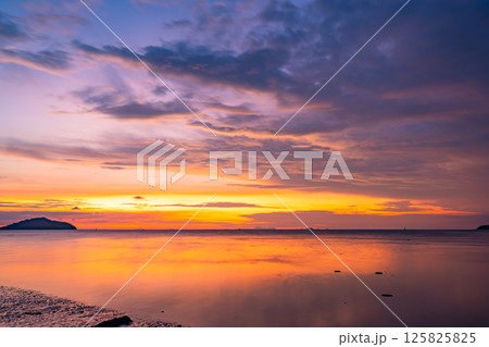 Nature beautiful light sunset or sunrise over sea surface,Colorful sunset sky with clouds and waves in the ocean,Wide angle sea background Nature beautiful light sunset or sunrise over sea surface,Colorful sunset sky with clouds and waves in the ocean,Wide angle sea background 125825825