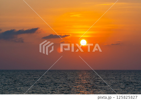 Nature beautiful light sunset or sunrise over sea surface,Colorful sunset sky with clouds and waves in the ocean,Wide angle sea background 125825827