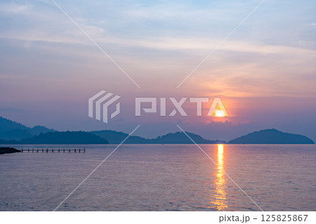 Nature beautiful light sunset or sunrise over sea surface,Colorful sunset sky with clouds and waves in the ocean,Wide angle sea background 125825867
