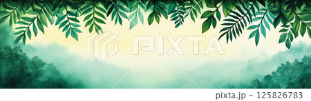 Lush green leaves frame misty jungle landscape, evoking tranquility 125826783
