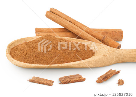 Cinnamon sticks with powder in wooden spoon isolated on white background with full depth of field Cinnamon sticks with powder in wooden spoon isolated on white background with full depth of field 125827010
