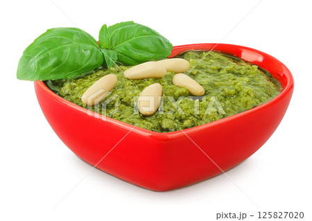 Pesto sauce in ceramic bowl isolated on white background Pesto sauce in ceramic bowl isolated on white background 125827020
