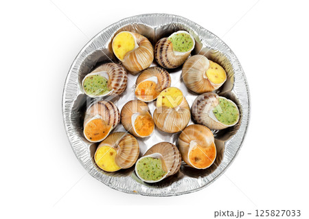 escargot snail filled with different fillings in a plastic packaging isolated on white background. Top view. Flat lay 125827033