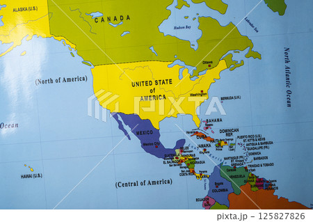 The country of the USA, or the United States of America on the world map. Located on the North American continent. Concept of travel and government The country of the USA, or the United States of America on the world map. Located on the North American continent. Concept of travel and government 125827826