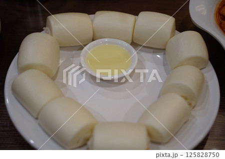 Steamed Mantou Buns with Dipping Sauce - Delicious Chinese Snack 125828750