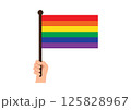 Hand holds vibrant rainbow flag symbolizing LGBTQ+ pride and diversity 125828967