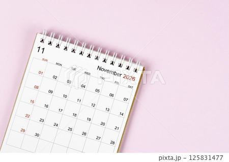 November 2026 desk calendar on pink background, Position with empty space. November 2026 desk calendar on pink background, Position with empty space. 125831477