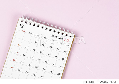 December 2026 desk calendar on pink background, Position with empty space. 125831478