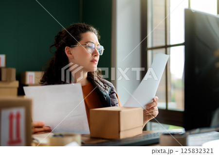 Woman working in a warehouse 125832321