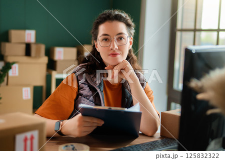 Woman working in a warehouse 125832322