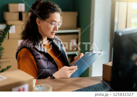 Woman working in a warehouse 125832327