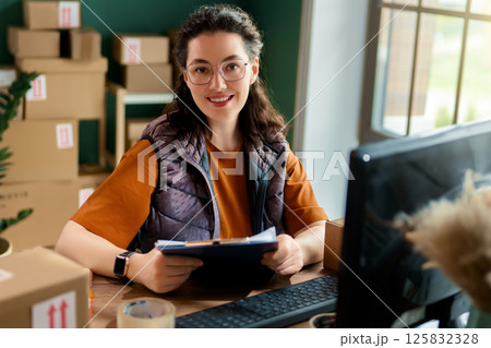Woman working in a warehouse 125832328