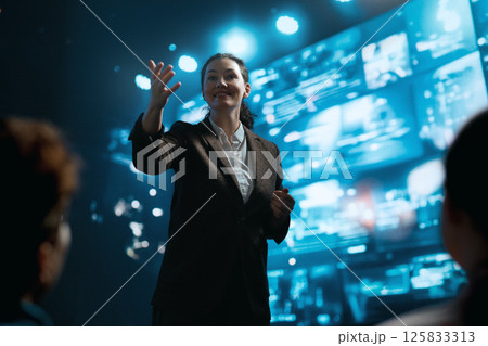 A woman is speaking on stage 125833313