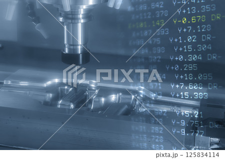 Abstract scene the CNC milling machine finish cut the mold parts and NC data background. Abstract scene the CNC milling machine finish cut the mold parts and NC data background. 125834114