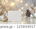 An inviting blank card with soft knitted fabric and natural pinecones 125834917