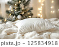 Cozy Bedroom Ambience with Plush Pillows and Warm String Lights 125834918