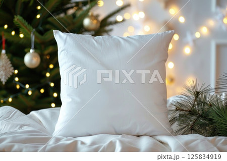 Cozy White Pillow on Fur Blanket with Christmas Tree Lights Background 125834919