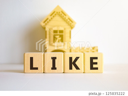 Like symbol. Concept word Like on beautiful wooden blocks. Beautiful white table white background. Wooden beautiful house. Business, lifestyle, support and like concept. Copy space. 125835222