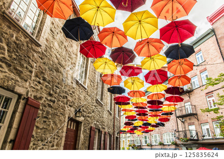 Lot of Umbrellas in Petit Champlain street Quebec city, Canada Lot of Umbrellas in Petit Champlain street Quebec city, Canada 125835624