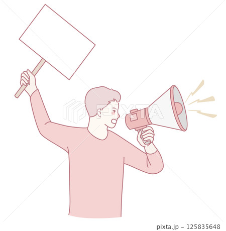 A young and passionate activist holding a megaphone and sign during a notable protest event 125835648