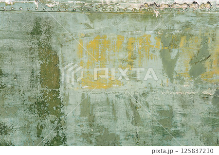 Vintage industrial texture with weathered paint and corroded surface. Textured rusty surface with vintage patina and weathered colorful paint. Great for creative backdrops and design uses 125837210