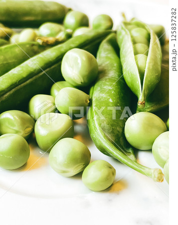 Harvest organic vegetables green peas. 125837282