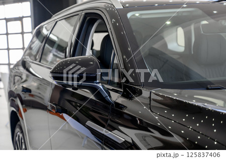 elements of the design of a modern car in a car showroom elements of the design of a modern car in a car showroom 125837406