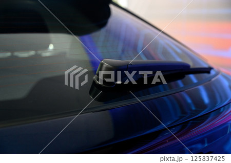 Car rear window wiper. Close-up of rear window wipers on a new car 125837425